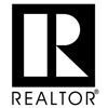 A black and white logo of realtor. Com
